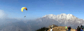 immagine del massiccio della presolana con parapendio in volo